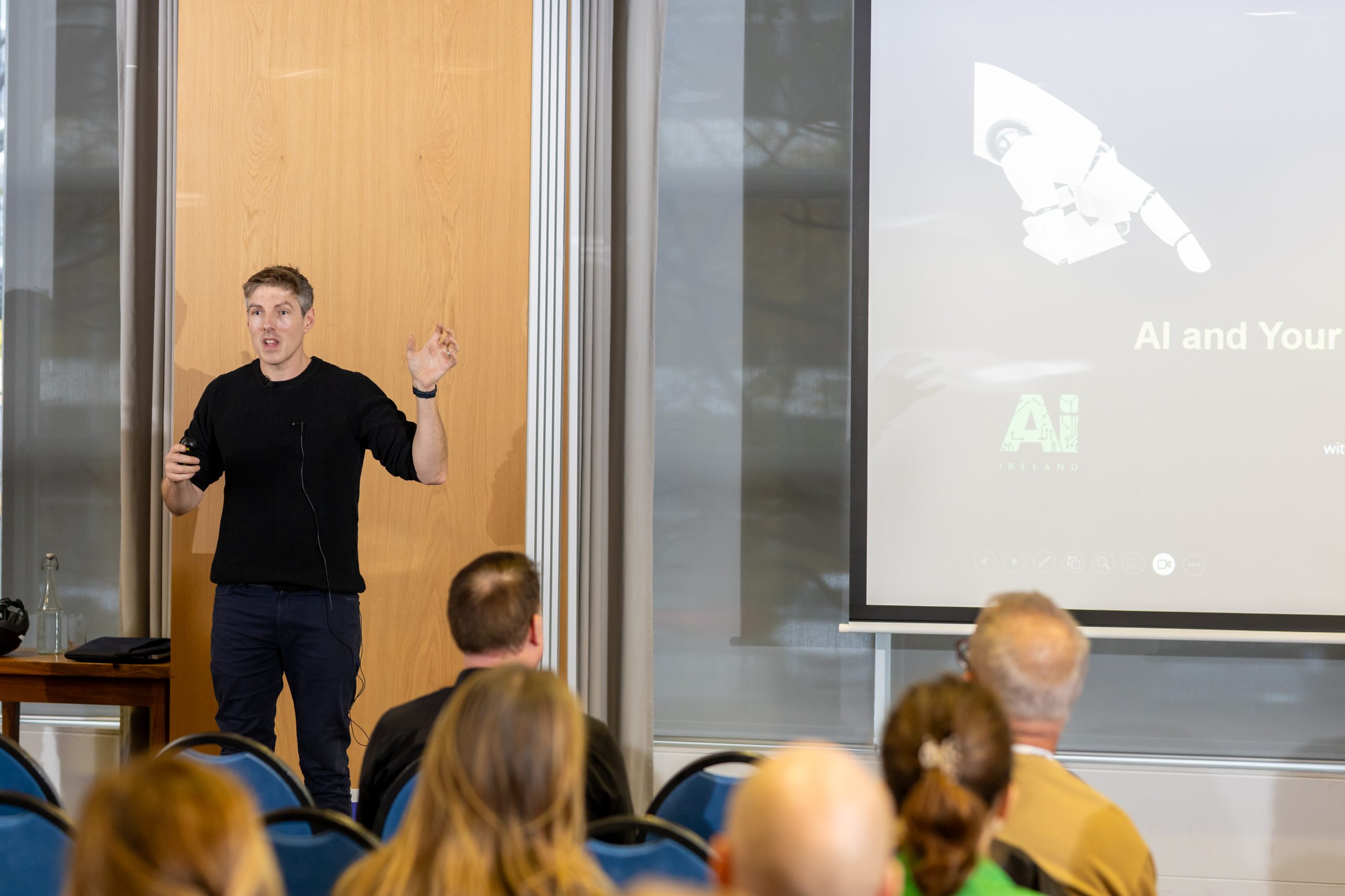 AI keynote speaker presenting practical AI insights to a business audience in Ireland