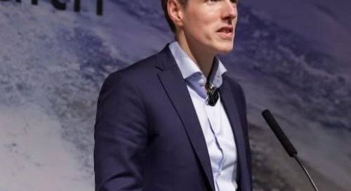 Mark Kelly, AI keynote speaker, delivering a keynote on stage at an international conference