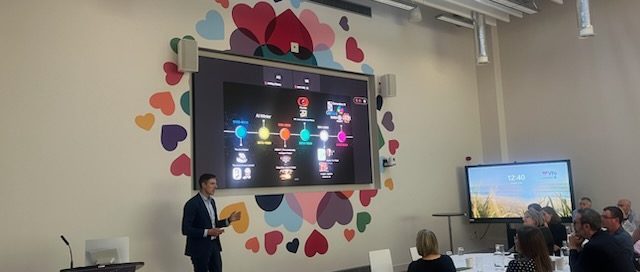 Keynote Speaker Mark Kelly discussing AI with VHI Leadership