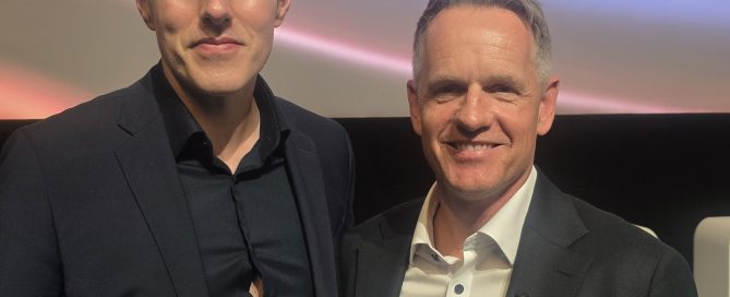 AI Keynote Speaker Mark Kelly standing alongside European Ryder Cup Captain Luke Donald at an event.